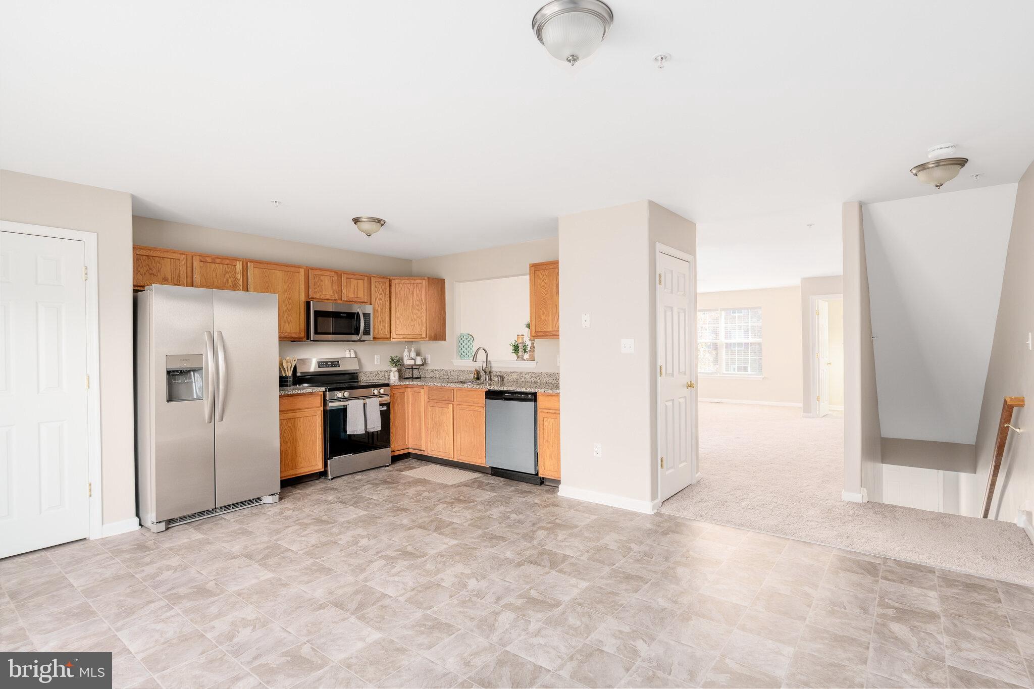 112 Ben Boulevard Elkton, MD 21921 - Photo 8 of 22 a kitchen with refrigerator and cabinets