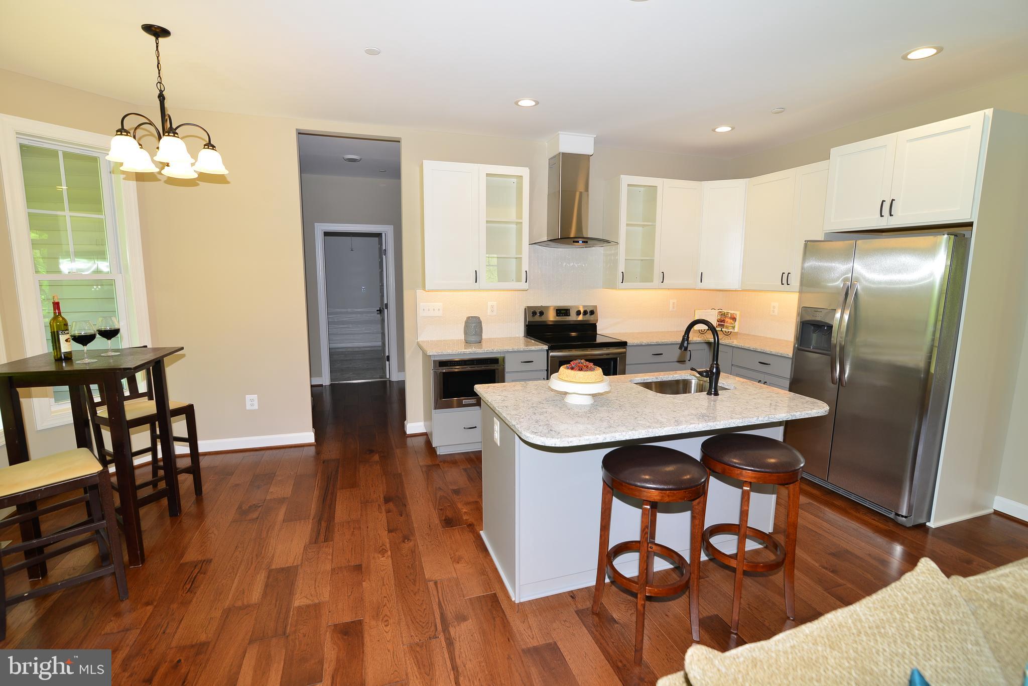 8700 Green Valley Road Union Bridge, MD 21791 - Photo 5 of 40 Kitchen has table space & seating at island.