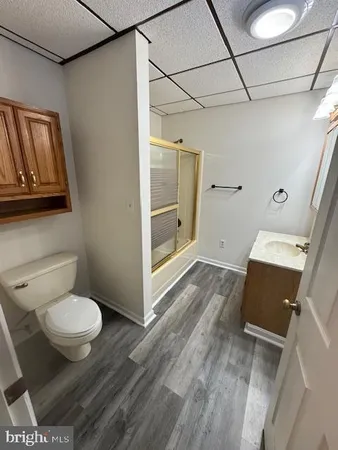 a bathroom with a toilet and a mirror