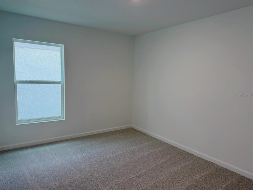 2154 Lasso Loop Eagle Lake, FL 33839 - Photo 12 of 32 an empty room with a window