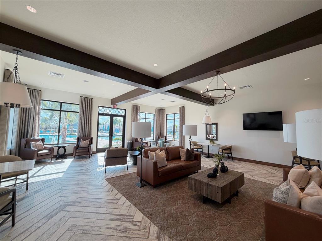 2154 Lasso Loop Eagle Lake, FL 33839 - Photo 26 of 32 a living room with furniture and a flat screen tv