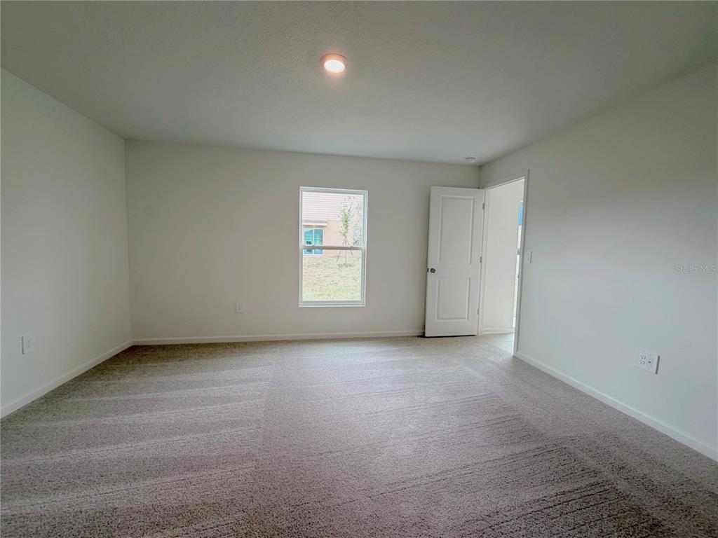 2154 Lasso Loop Eagle Lake, FL 33839 - Photo 8 of 32 an empty room with windows