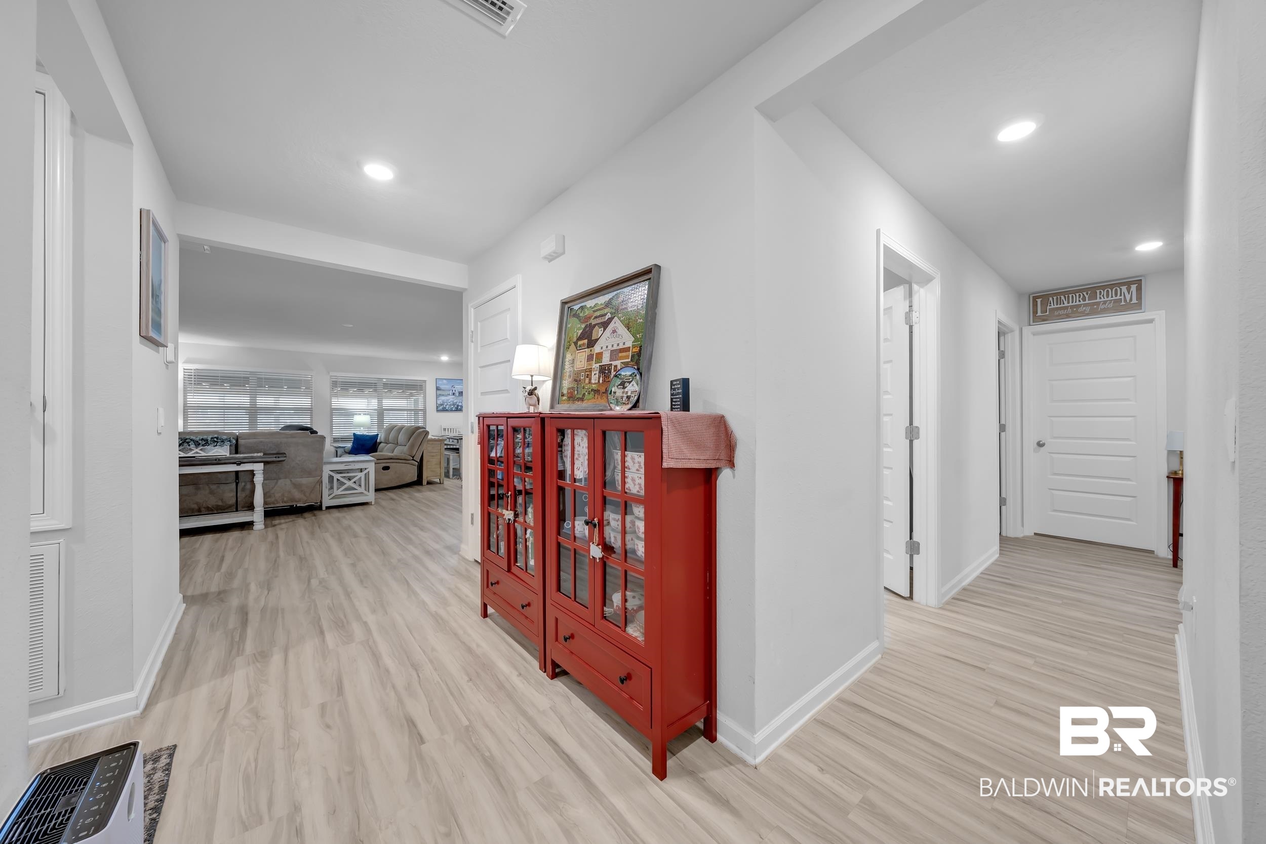 24271 Ringneck Loop Elberta, AL 36530 - Photo 7 of 44 Hallway featuring wood-finish flooring, recessed lighting, and bright white walls