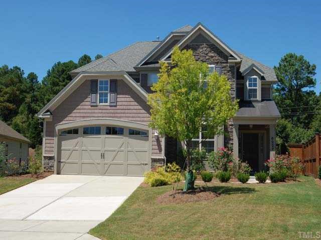 6227 Oconner Street Raleigh, NC 27617 - Photo 1 of 11 a front view of a house with garden