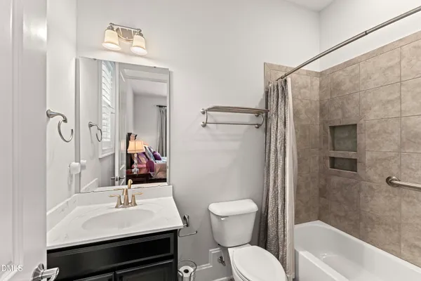 a bedroom with two beds and a window