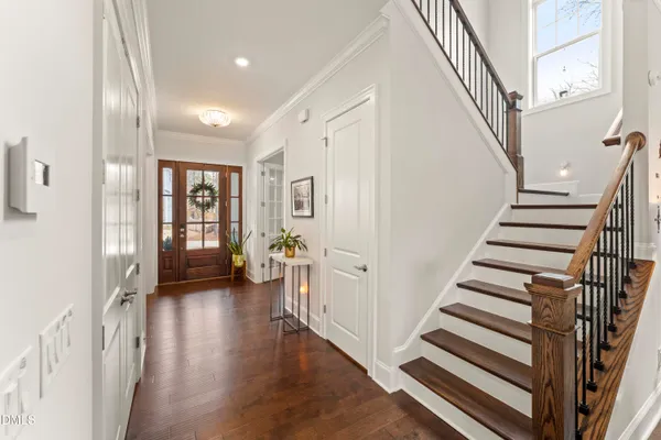 a bedroom with a bed and a chair