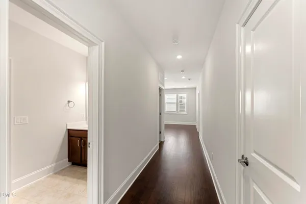 a living room with furniture a window and a ceiling fan