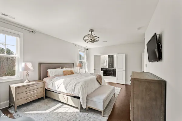 a living room with furniture and floor to ceiling windows
