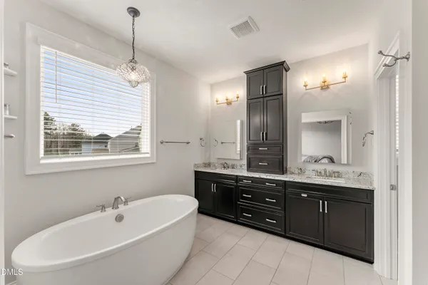a view of a patio with table and chairs with wooden floor and fence