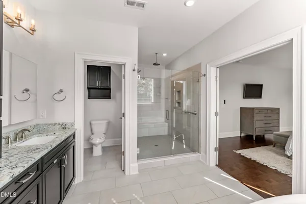 a backyard of a house with a large tree