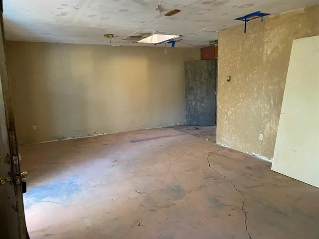 an empty room with a wooden door