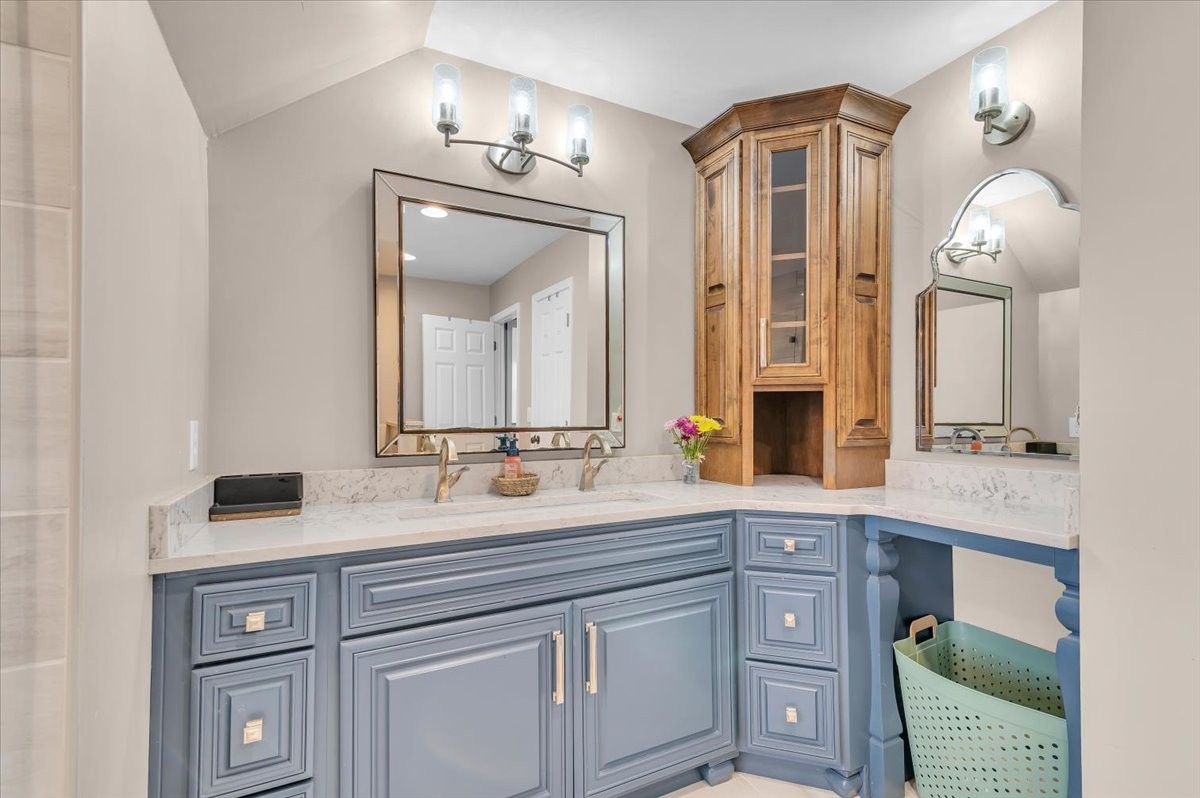 310 Edd Joyce Road Bell Buckle, TN 37020 - Photo 11 of 67 a bathroom with a double vanity sink and a mirror