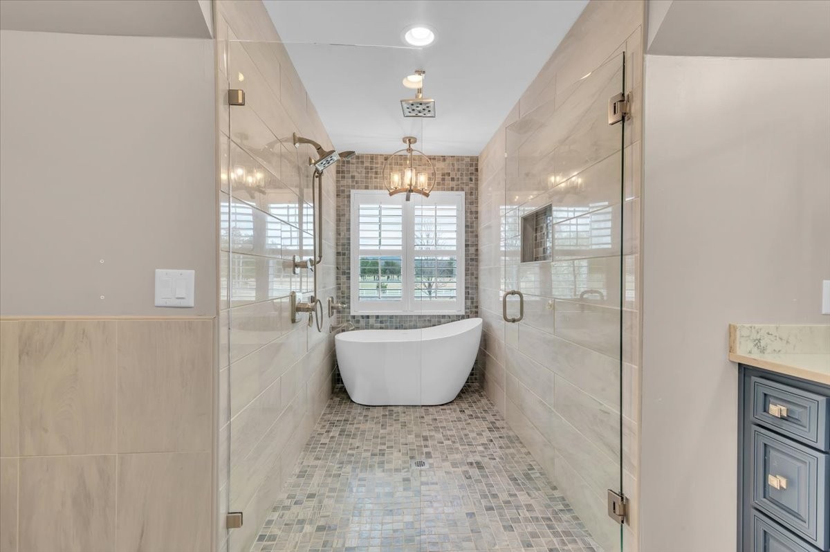 310 Edd Joyce Road Bell Buckle, TN 37020 - Photo 13 of 67 a bathroom with a bathtub and shower