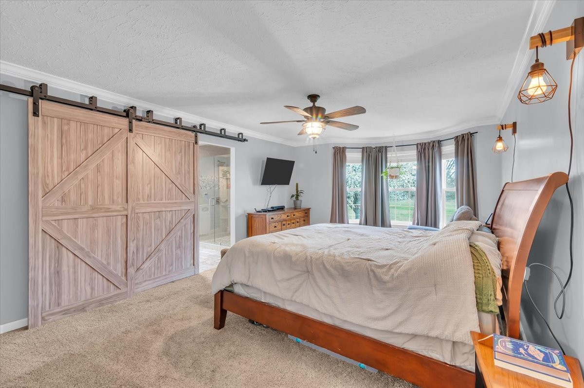 310 Edd Joyce Road Bell Buckle, TN 37020 - Photo 16 of 67 a bed room with a bed and a window