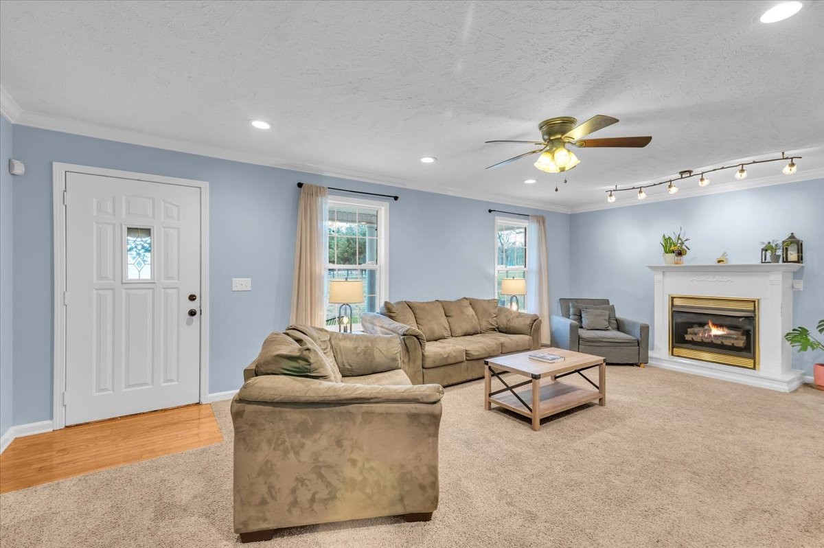 310 Edd Joyce Road Bell Buckle, TN 37020 - Photo 19 of 67 a living room with furniture and a fireplace