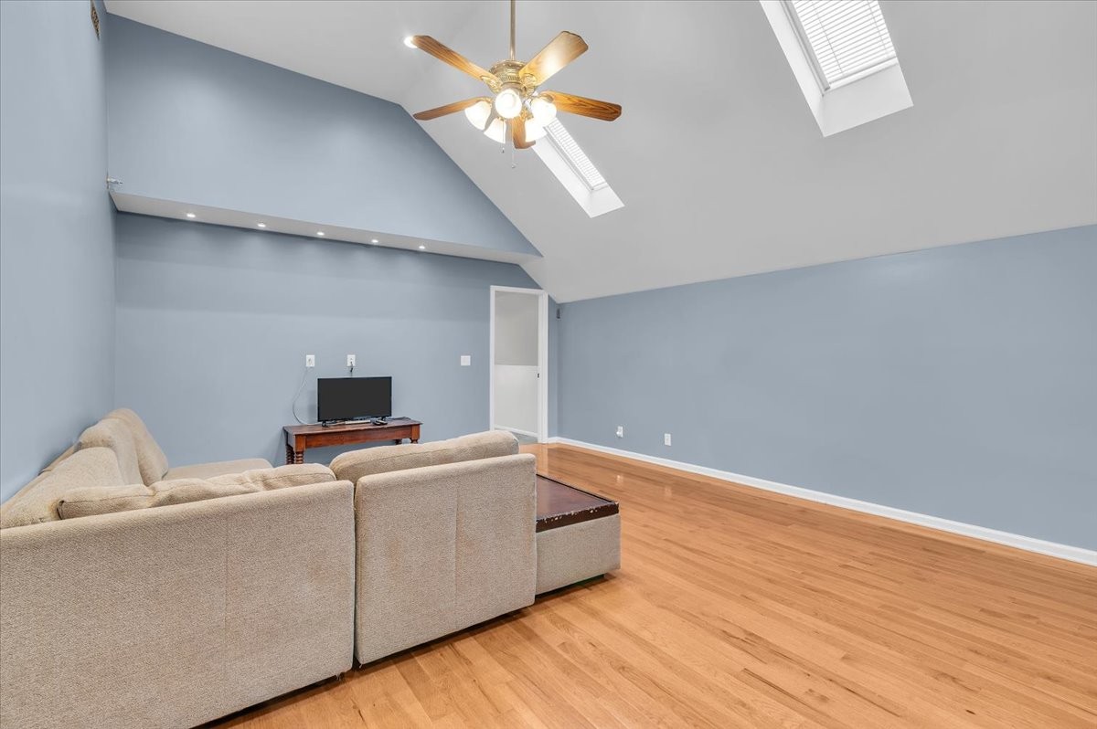 310 Edd Joyce Road Bell Buckle, TN 37020 - Photo 23 of 67 a room with a bed and a chandelier fan