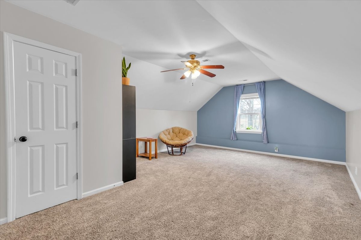 310 Edd Joyce Road Bell Buckle, TN 37020 - Photo 25 of 67 a view of a livingroom with a couch and chandelier fan