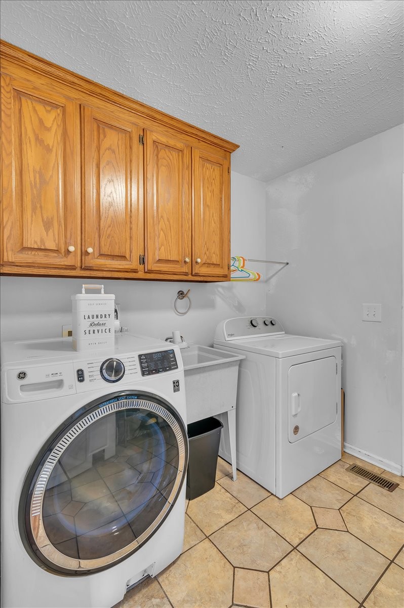 310 Edd Joyce Road Bell Buckle, TN 37020 - Photo 27 of 67 a utility room with dryer and washer