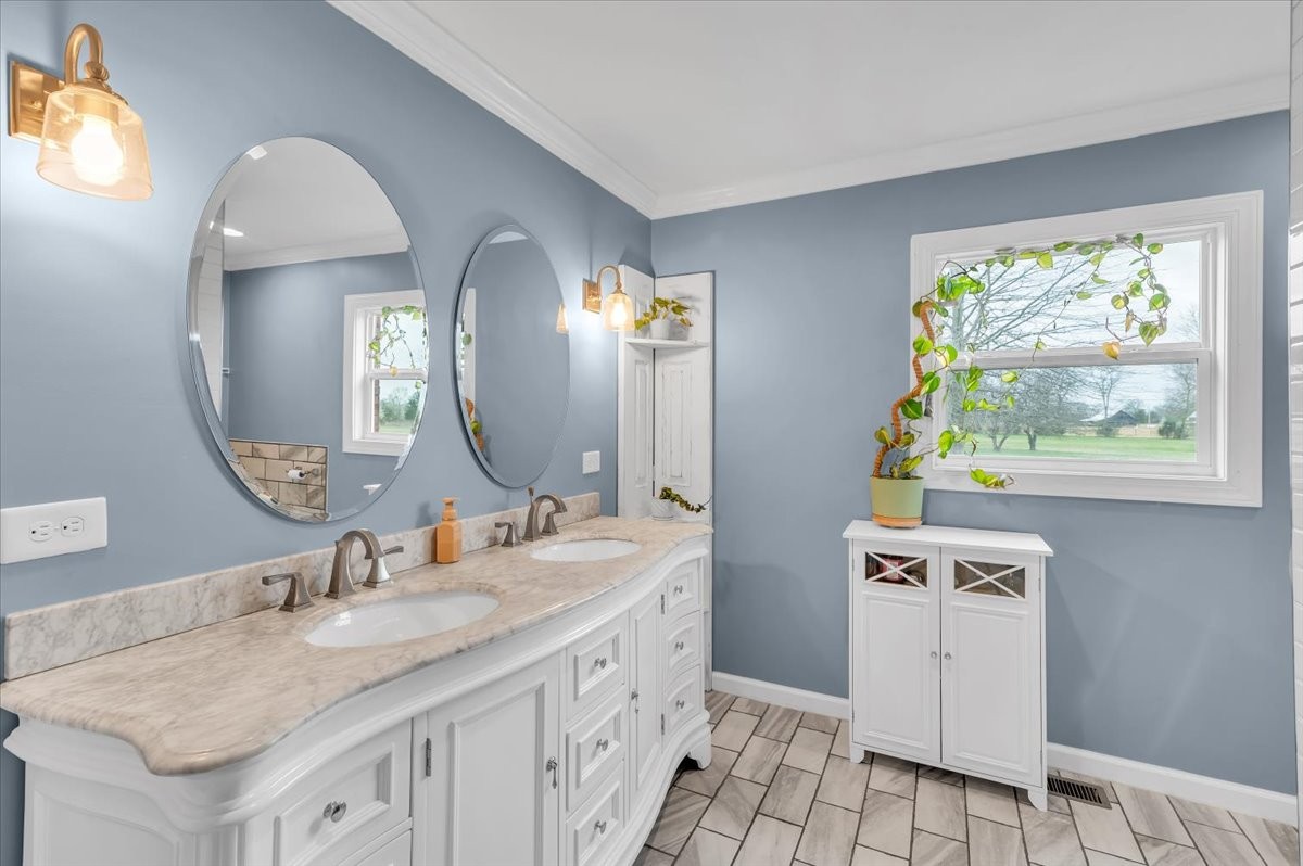 310 Edd Joyce Road Bell Buckle, TN 37020 - Photo 28 of 67 a bathroom with a granite countertop sink and a mirror