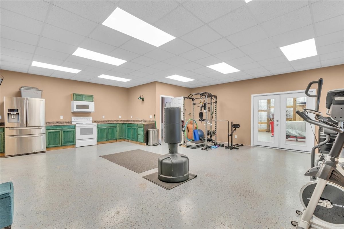 310 Edd Joyce Road Bell Buckle, TN 37020 - Photo 39 of 67 a gym room with lots of gym equipment