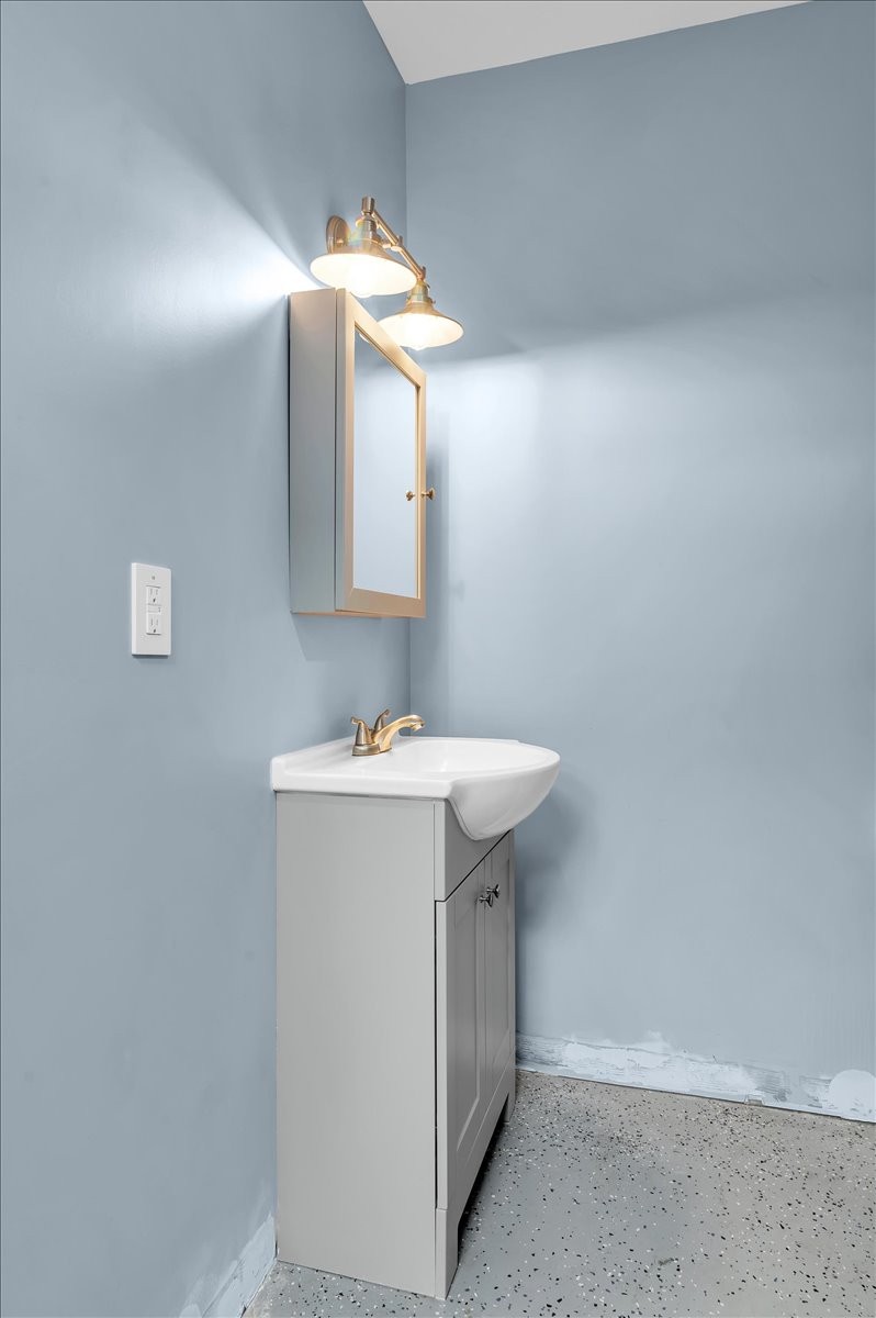 310 Edd Joyce Road Bell Buckle, TN 37020 - Photo 42 of 67 a bathroom with a sink and a mirror