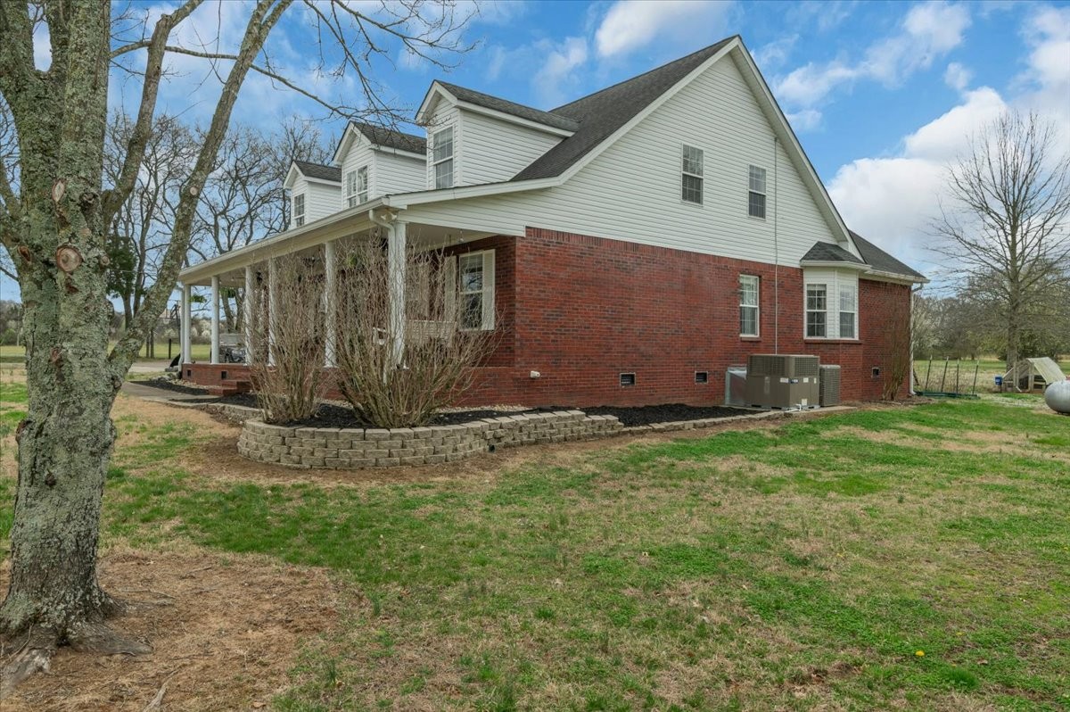 310 Edd Joyce Road Bell Buckle, TN 37020 - Photo 47 of 67 a view of a house with a yard