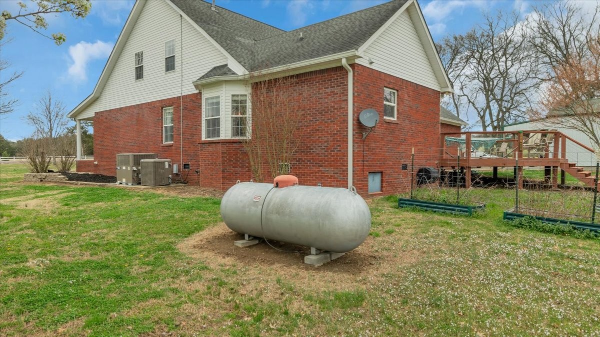 310 Edd Joyce Road Bell Buckle, TN 37020 - Photo 48 of 67 a view of a backyard with a garden and plants