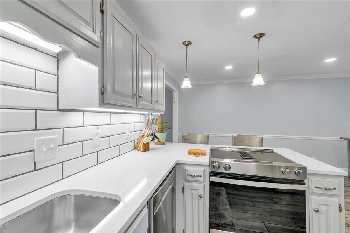 310 Edd Joyce Road Bell Buckle, TN 37020 - Photo 5 of 67 a kitchen with a sink a stove and cabinets