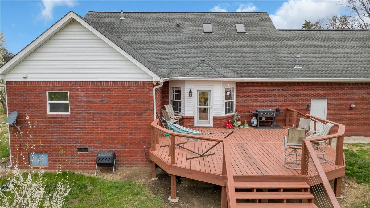310 Edd Joyce Road Bell Buckle, TN 37020 - Photo 55 of 67 a balcony with table and chairs