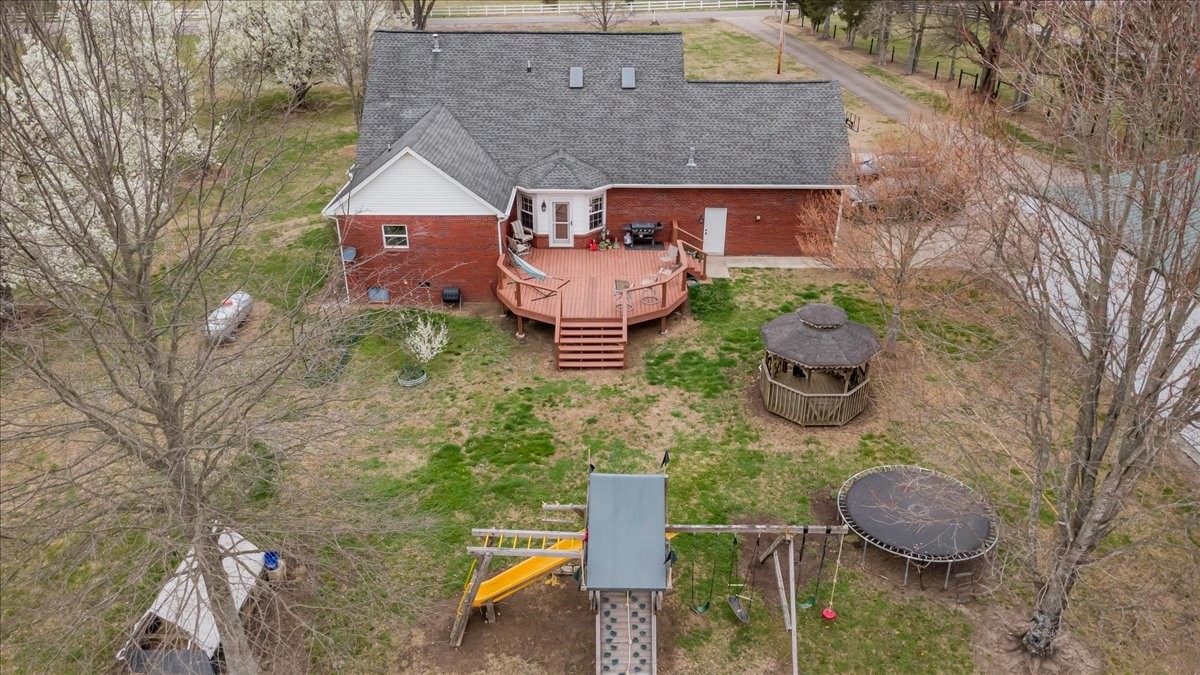 310 Edd Joyce Road Bell Buckle, TN 37020 - Photo 58 of 67 a front view of a house with garden