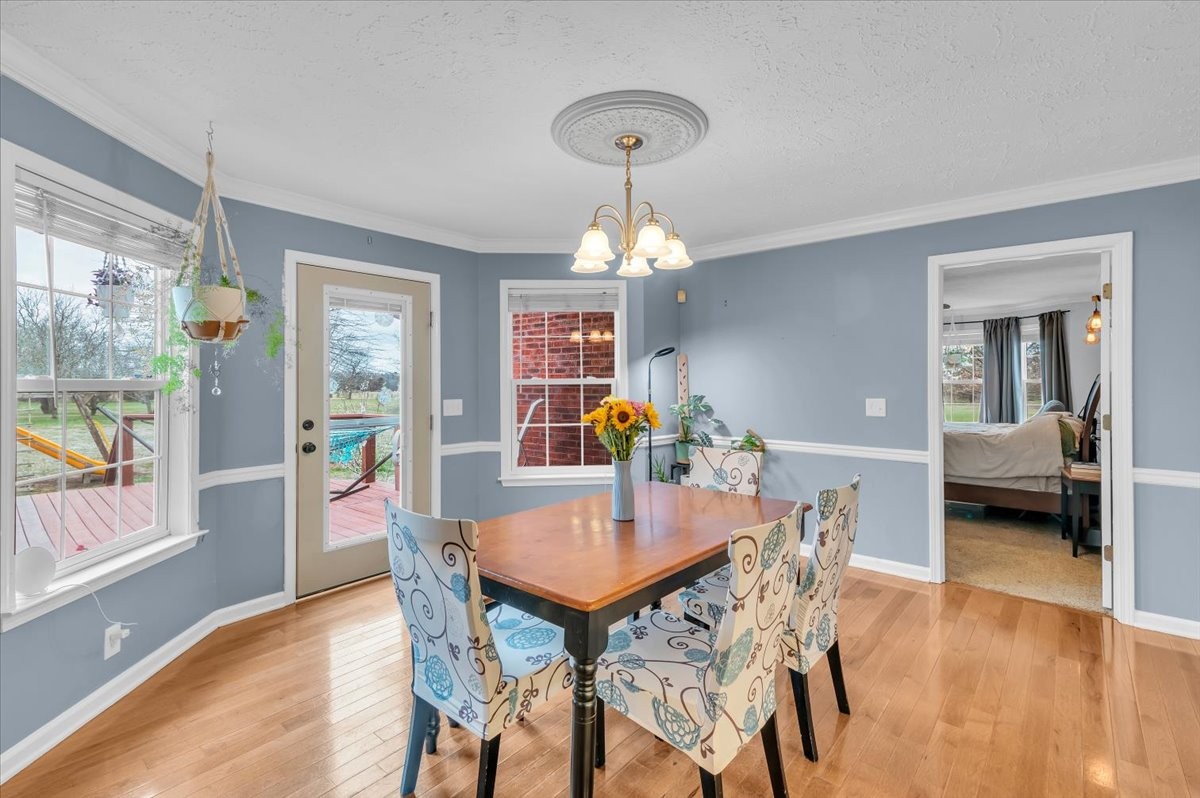 310 Edd Joyce Road Bell Buckle, TN 37020 - Photo 9 of 67 a view of a dining room with furniture and a chandelier
