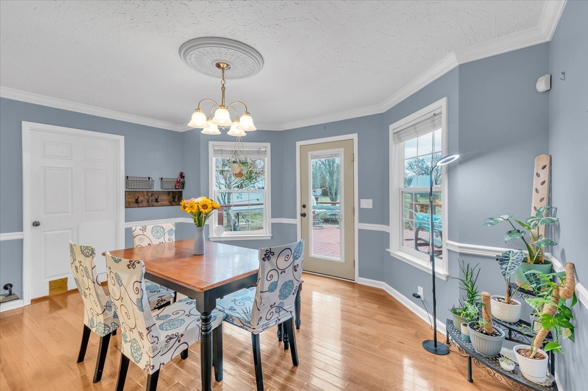 310 Edd Joyce Road Bell Buckle, TN 37020 - Photo 10 of 67 a view of a dining room with furniture window and wooden floor