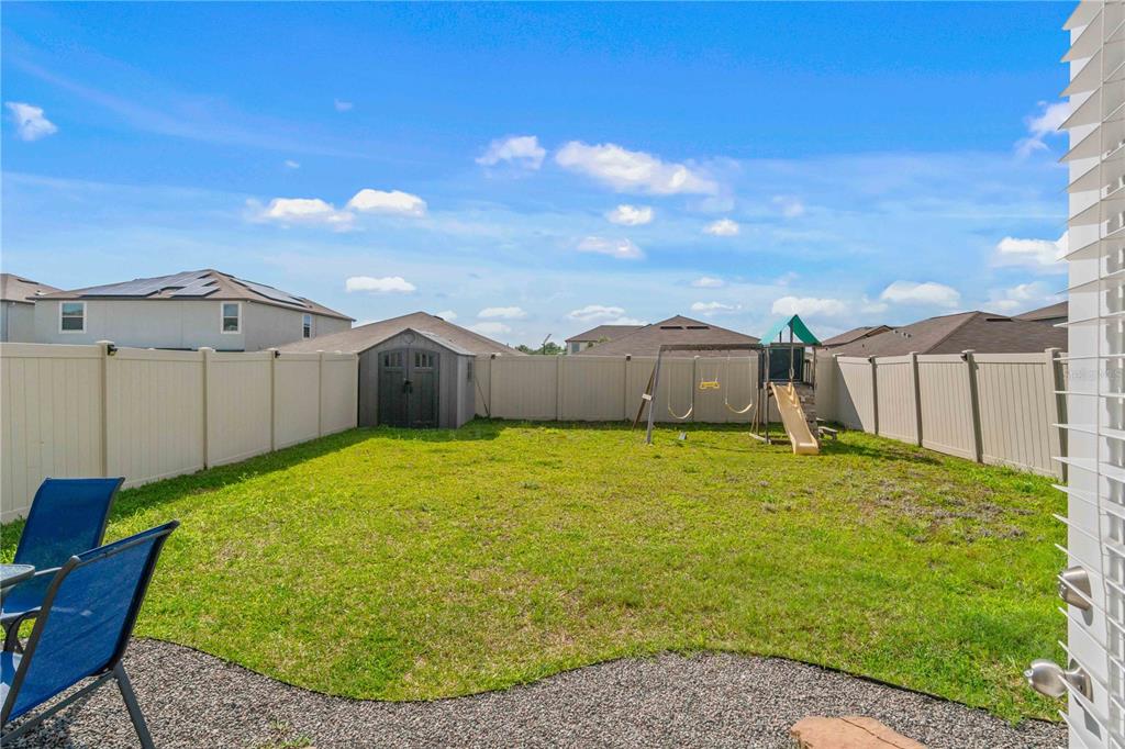9440 Lemon Drop Loop Sun City Center, FL 33573 - Photo 46 of 55 a house view with a garden space