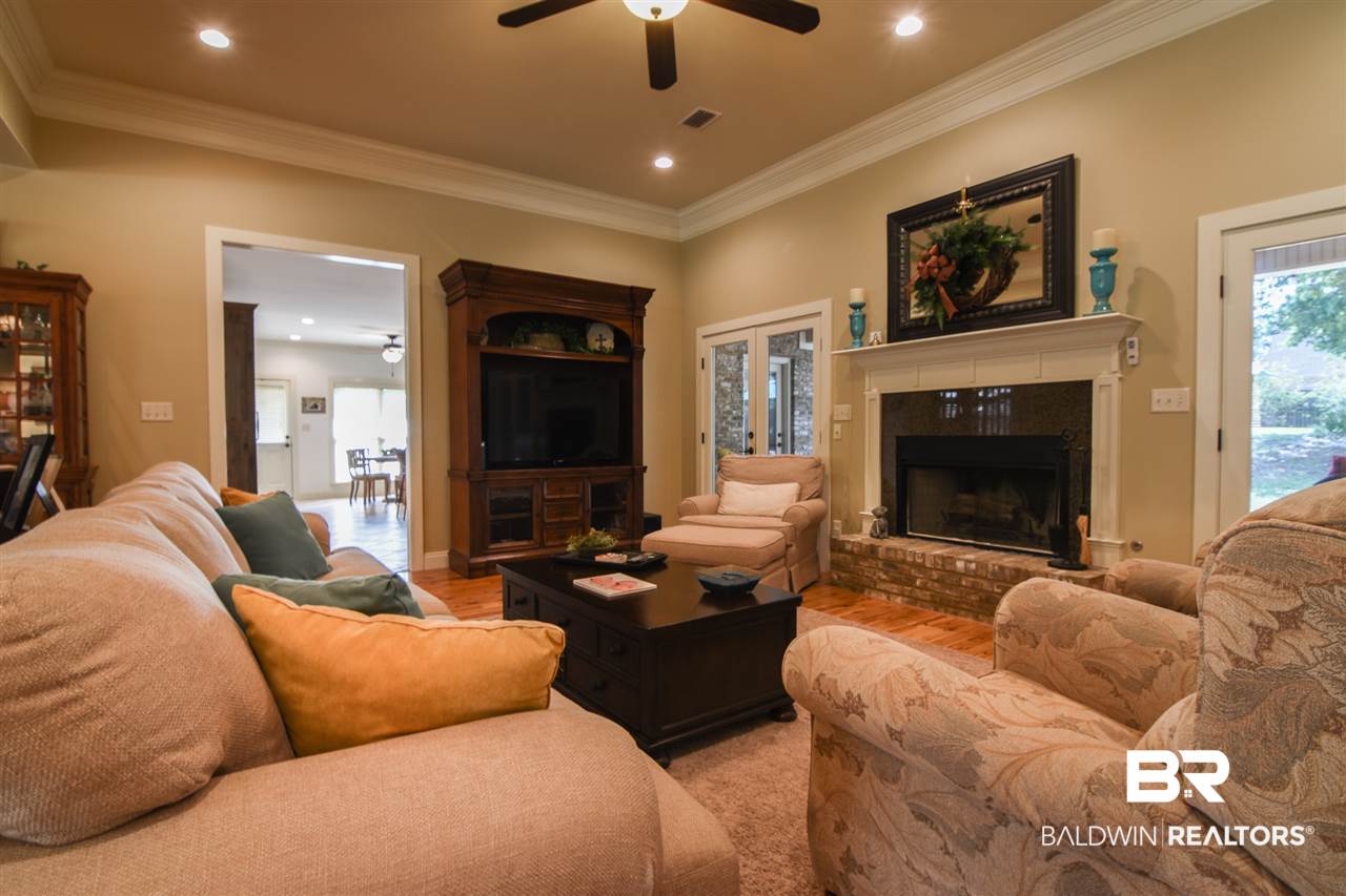 10948 Niblick Loop Fairhope, AL 36532 - Photo 8 of 30 Hardwoods, woodburning fireplace w/ gas start