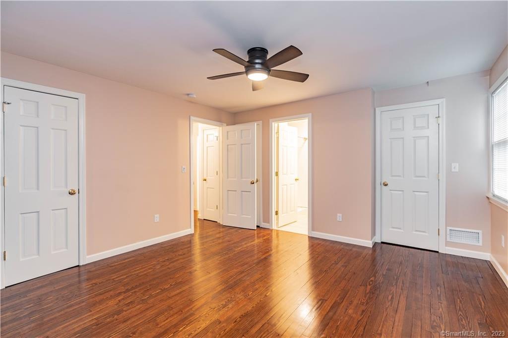 1241 Halladay Avenue West Suffield, CT 06078 - Photo 21 of 29 a view of an empty room with wooden floor and a ceiling fan