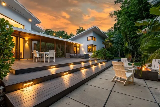 a view of swimming pool with outdoor seating