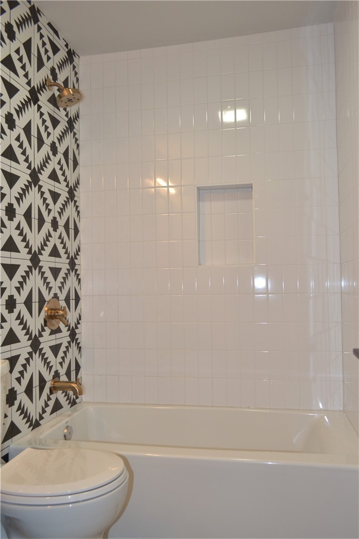 7206 Meador Avenue, Unit B Austin, TX 78752 - Photo 14 of 19 Soaking tub with standing shower