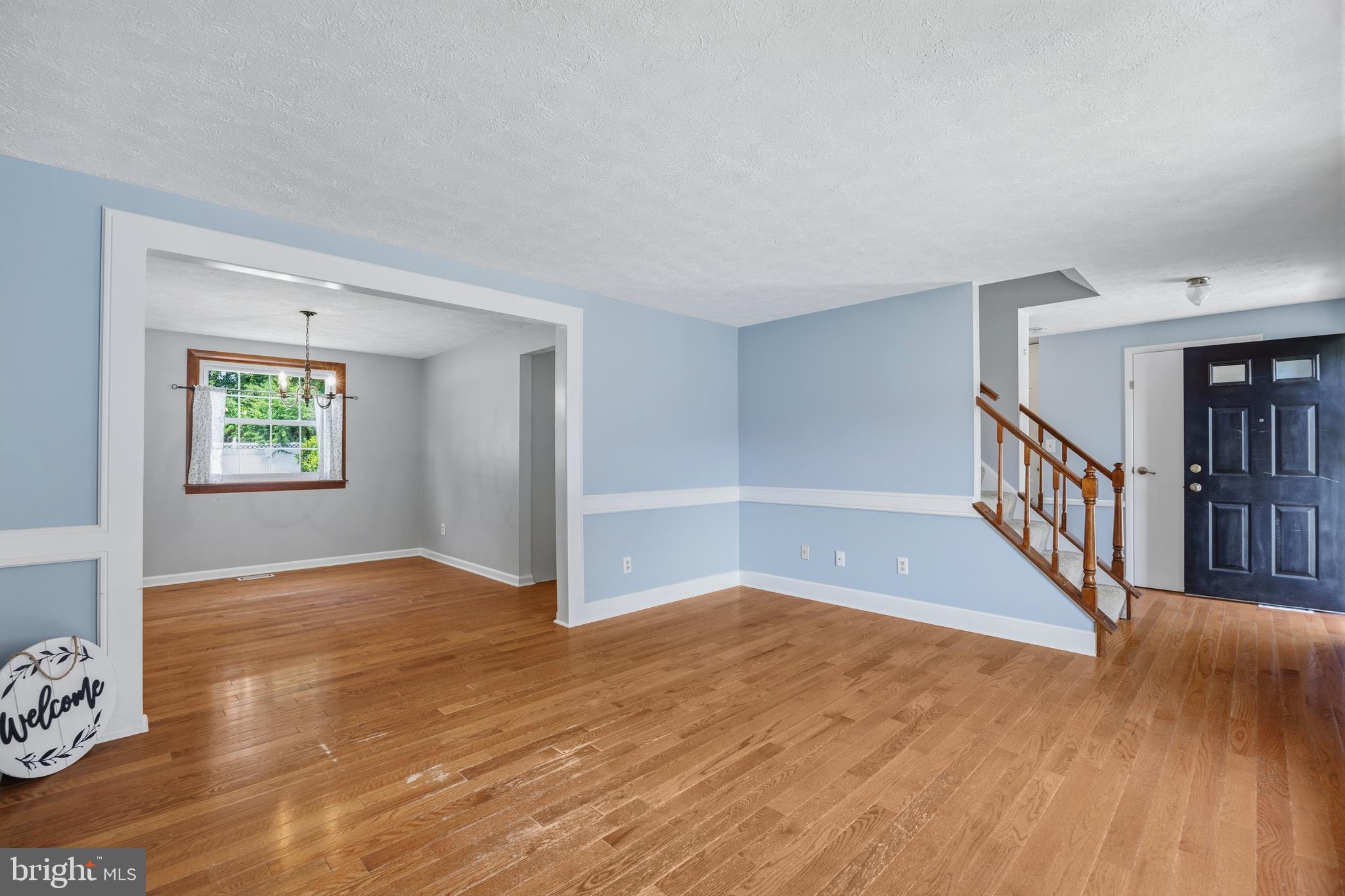 1506 Gollum Road Hanover, MD 21076 - Photo 7 of 44 a view of an empty room with wooden floor and a window