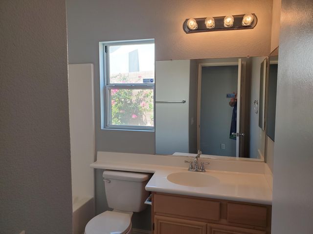 a bathroom with a sink and a toilet