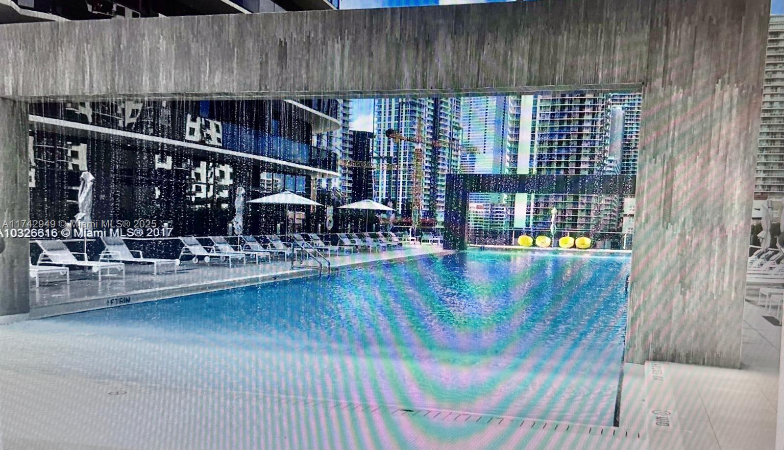 Brickell Heights II Miami, FL 33130 - Photo 4 of 7 a view of swimming pool with outdoor seating