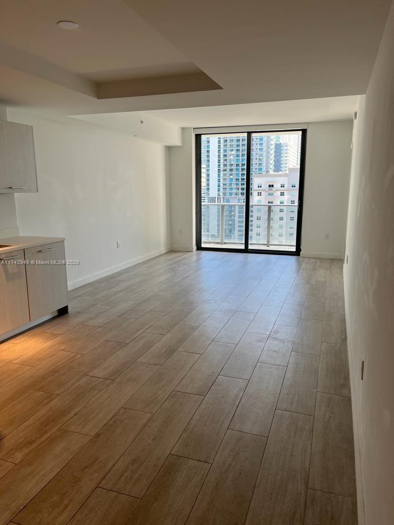 Brickell Heights II Miami, FL 33130 - Photo 5 of 7 wooden floor in an empty room with a window