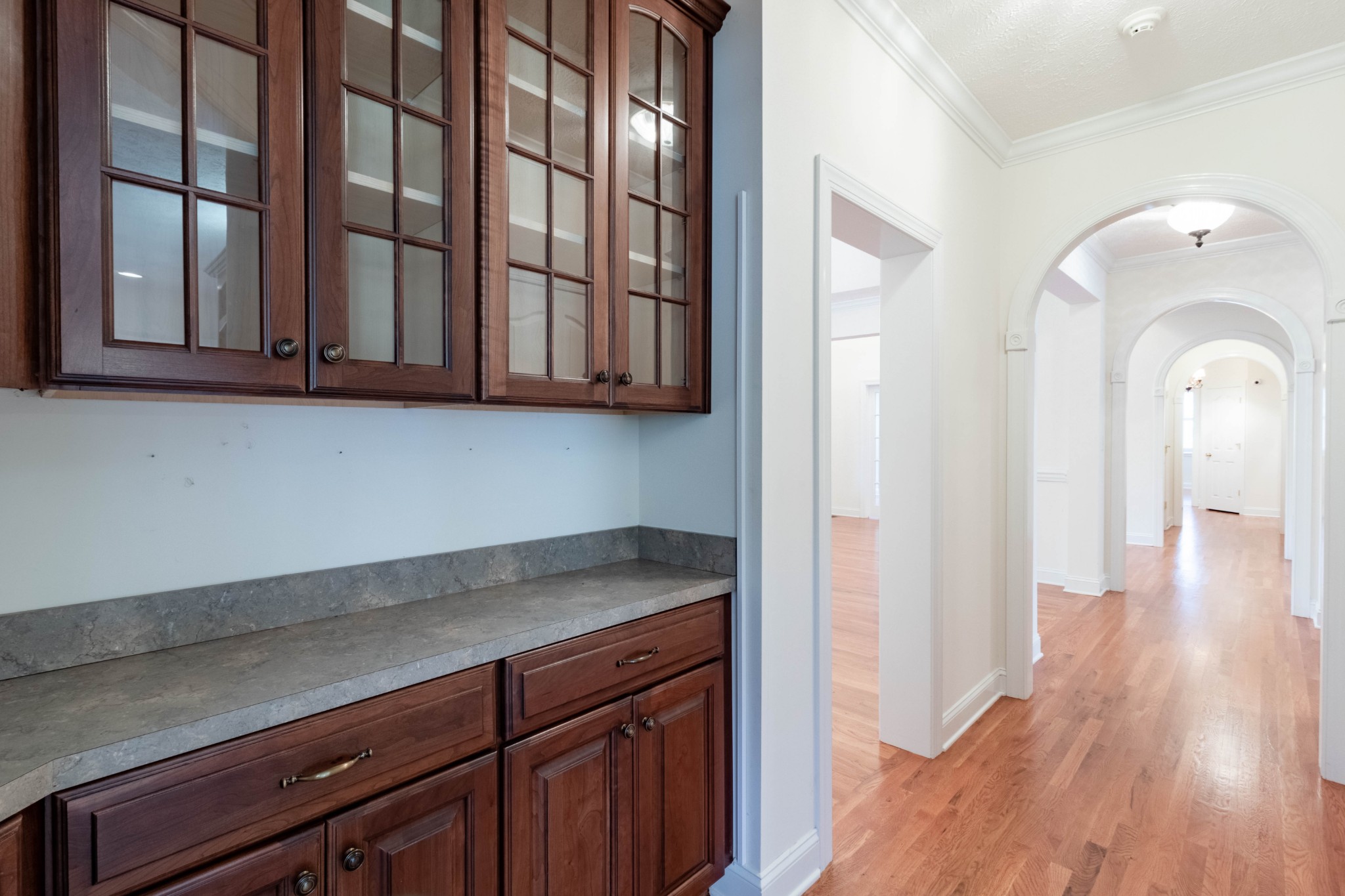 563 Pond Apple Road Clarksville, TN 37043 - Photo 13 of 39 a view of a kitchen with wooden floor and cabinets