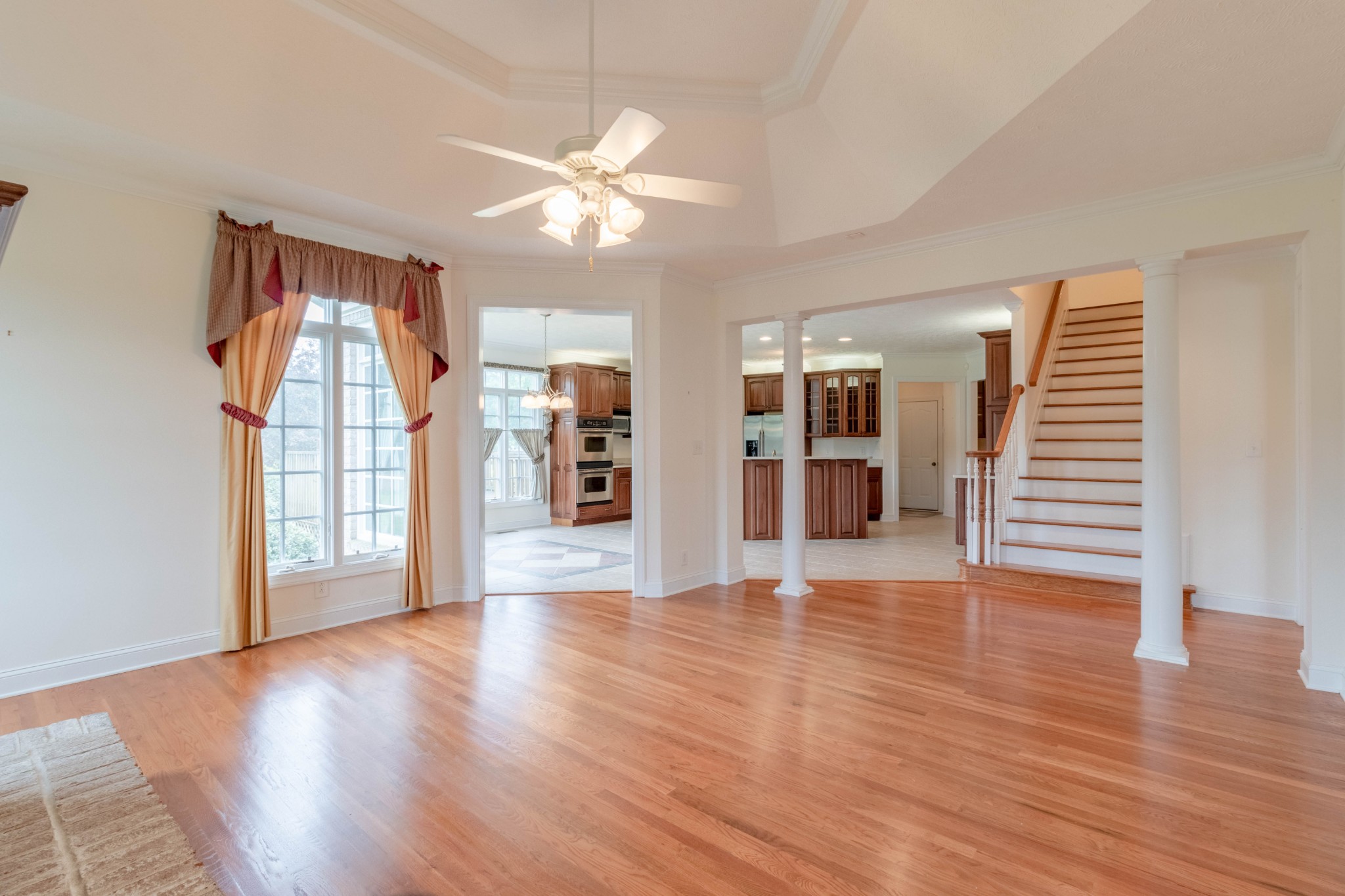 563 Pond Apple Road Clarksville, TN 37043 - Photo 15 of 39 a view of an empty room with wooden floor and staircase