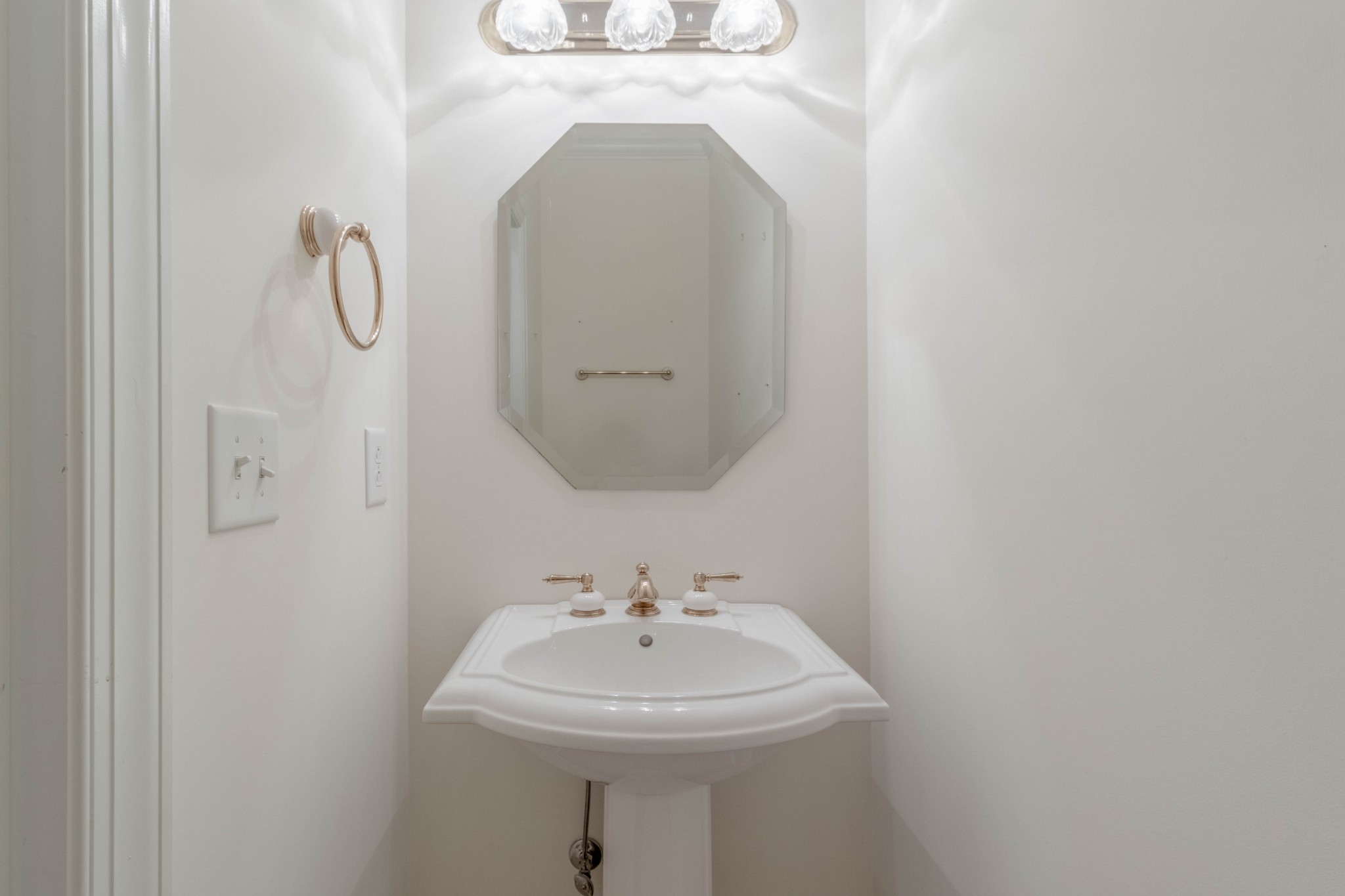 563 Pond Apple Road Clarksville, TN 37043 - Photo 18 of 39 a bathroom with a sink a mirror and shower