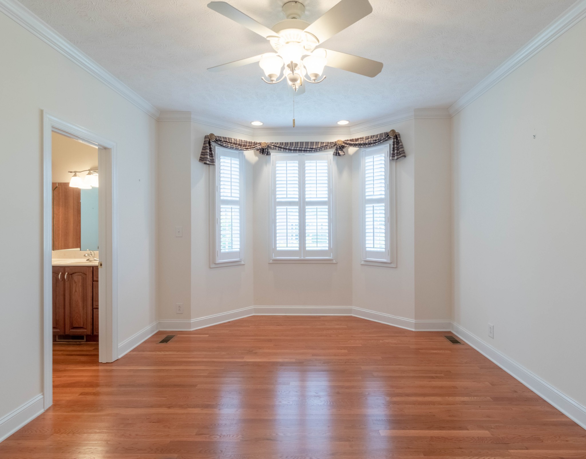 563 Pond Apple Road Clarksville, TN 37043 - Photo 26 of 39 a view of an empty room with wooden floor and a window