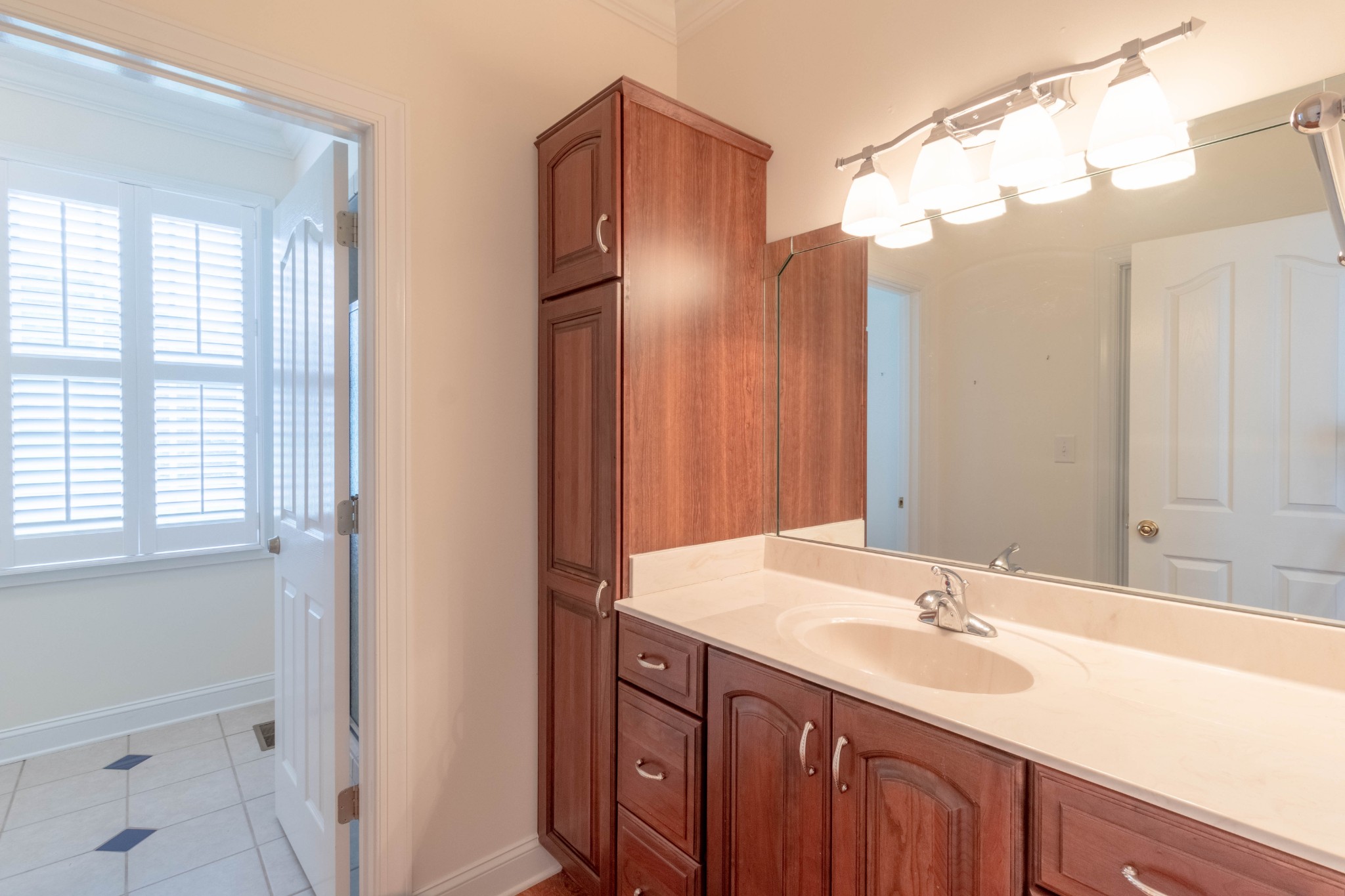 563 Pond Apple Road Clarksville, TN 37043 - Photo 27 of 39 a bathroom with a sink double vanity and a mirror
