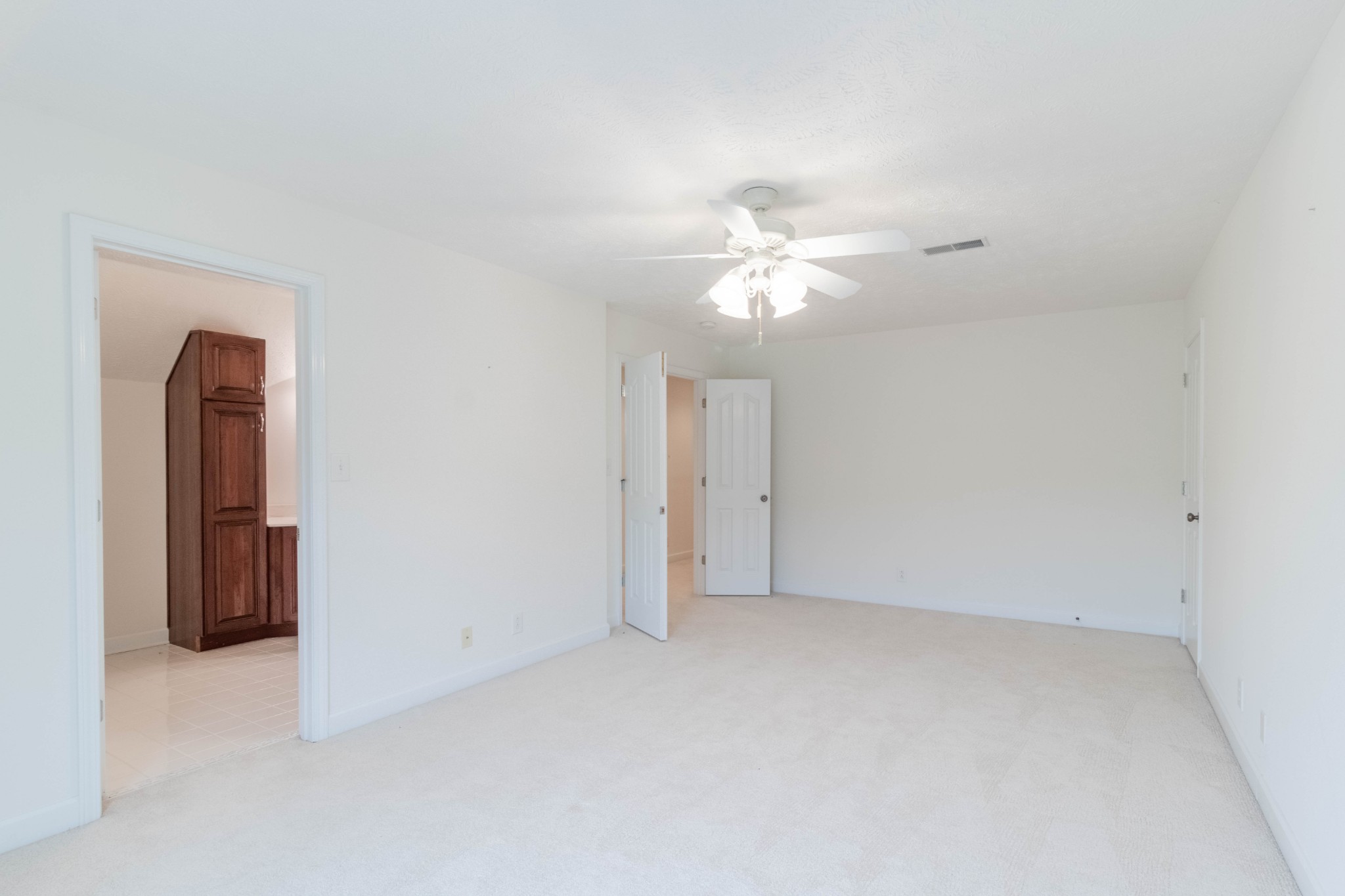 563 Pond Apple Road Clarksville, TN 37043 - Photo 31 of 39 an empty room with a chandelier fan and a window