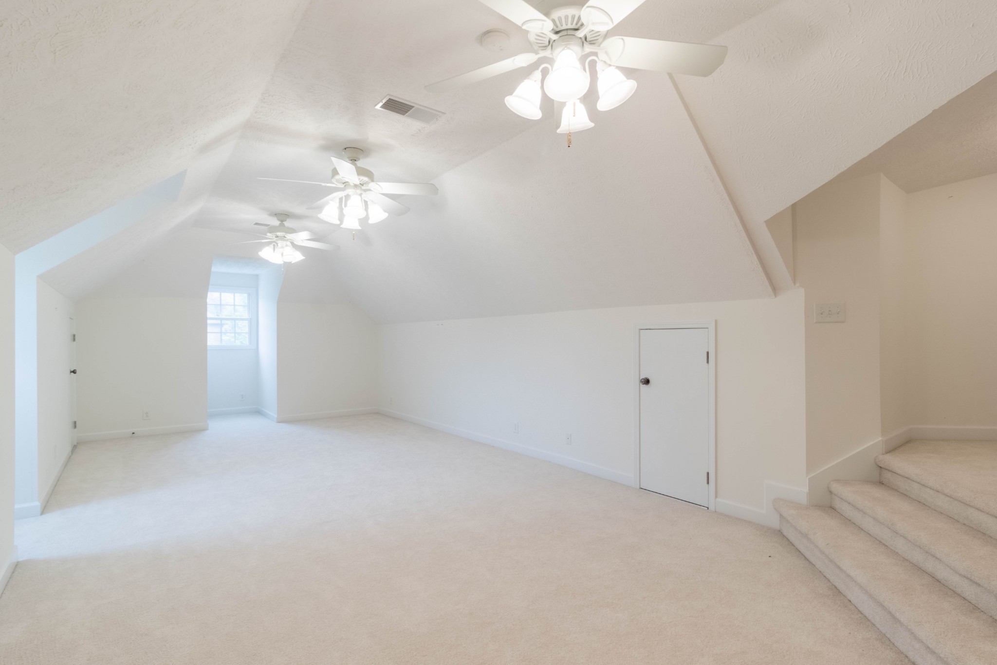 563 Pond Apple Road Clarksville, TN 37043 - Photo 35 of 39 wooden floor in an empty room with a chandelier fan