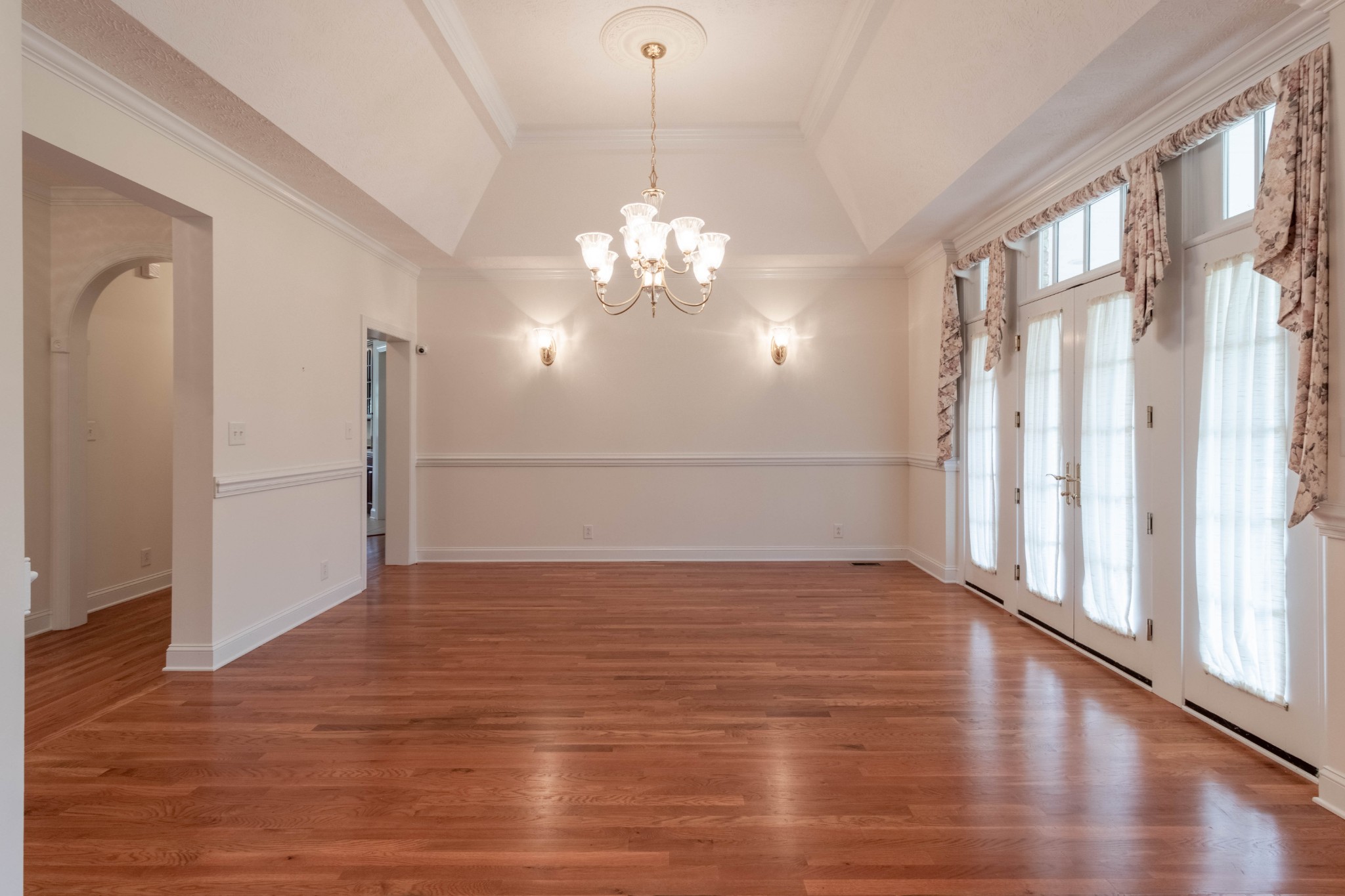563 Pond Apple Road Clarksville, TN 37043 - Photo 6 of 39 a view of an empty room with wooden floor and a window