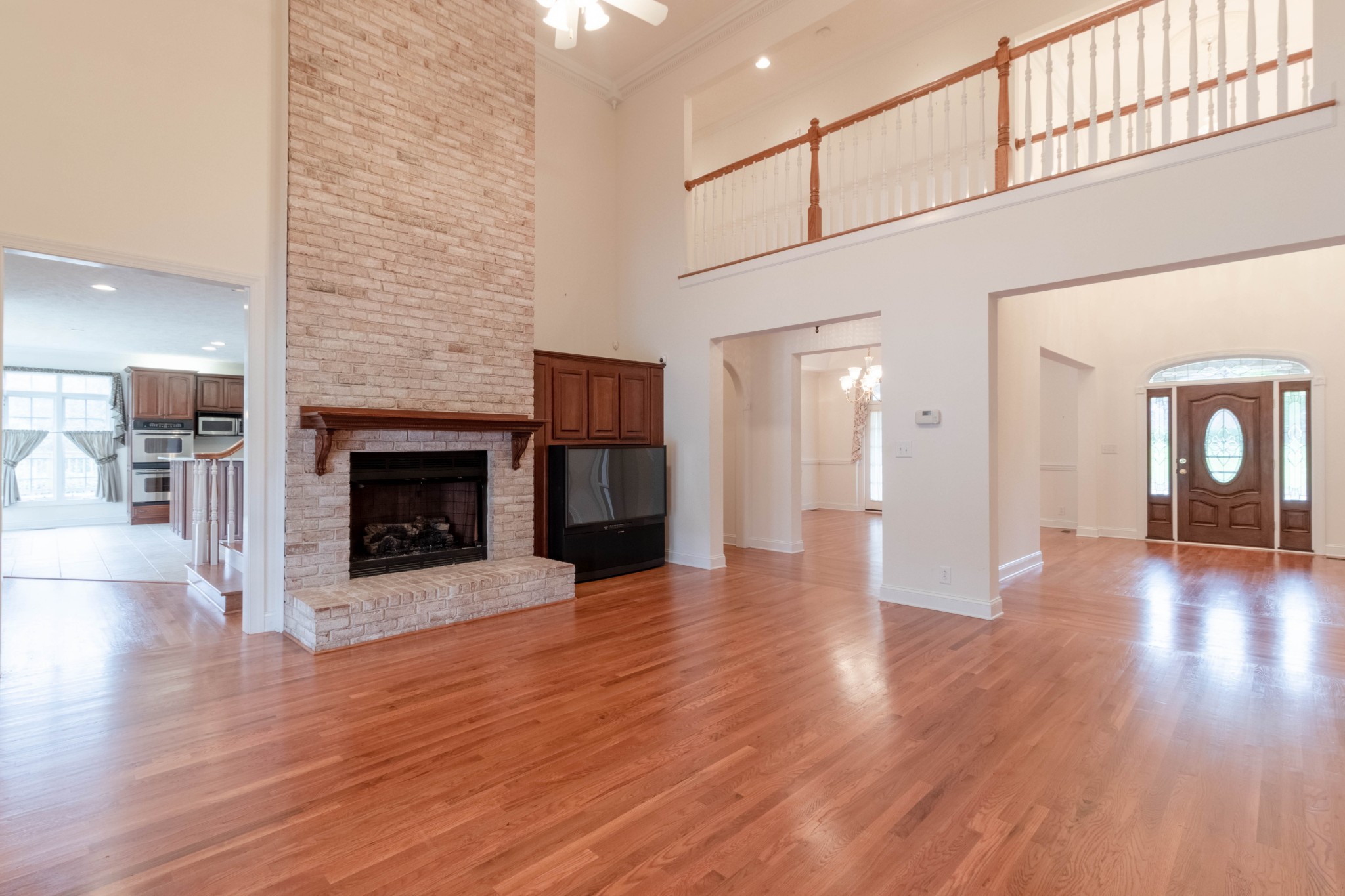563 Pond Apple Road Clarksville, TN 37043 - Photo 7 of 39 a view of a livingroom with wooden floor and a fireplace